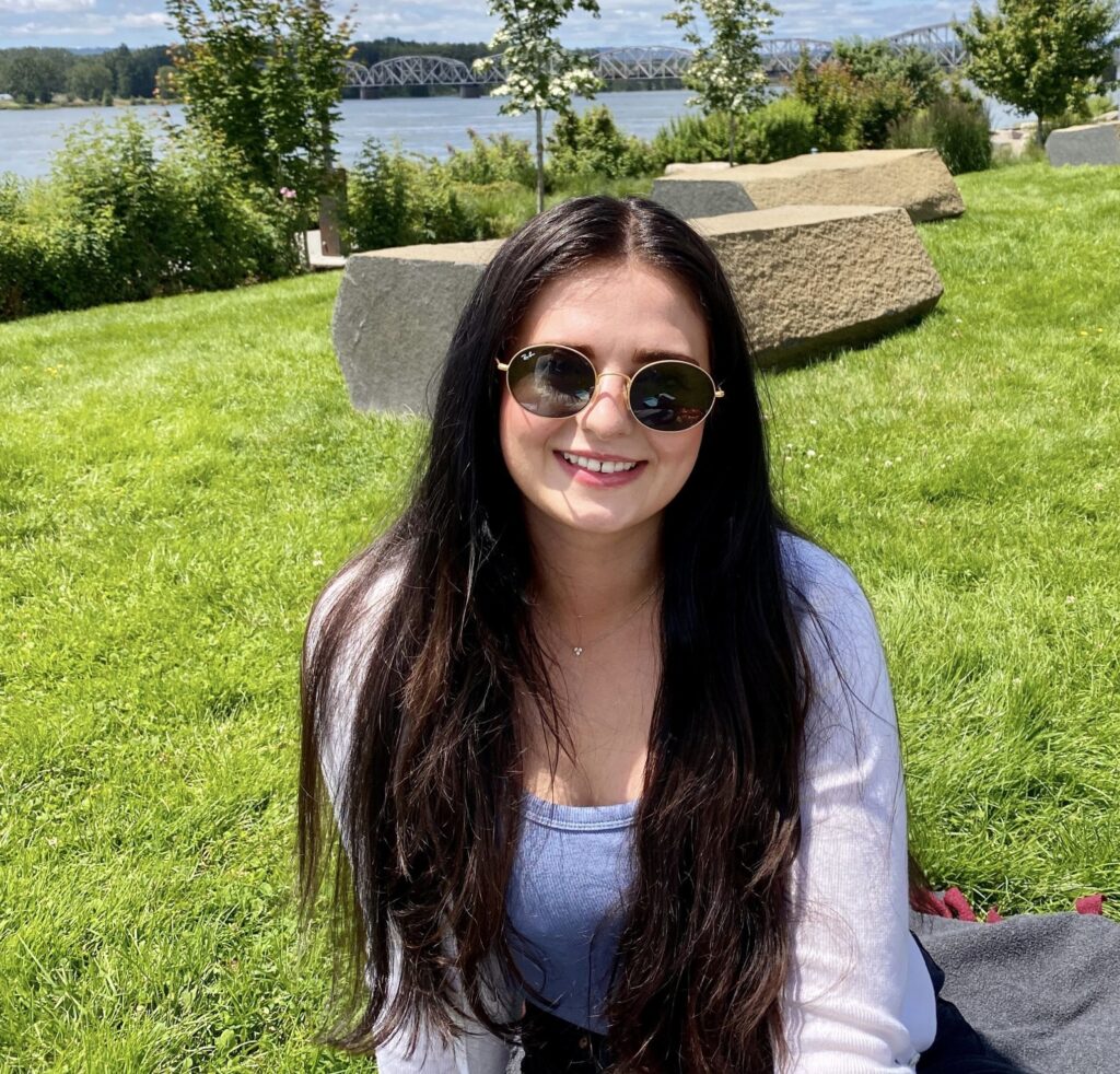 jennifer wearing sunglasses on a lawn