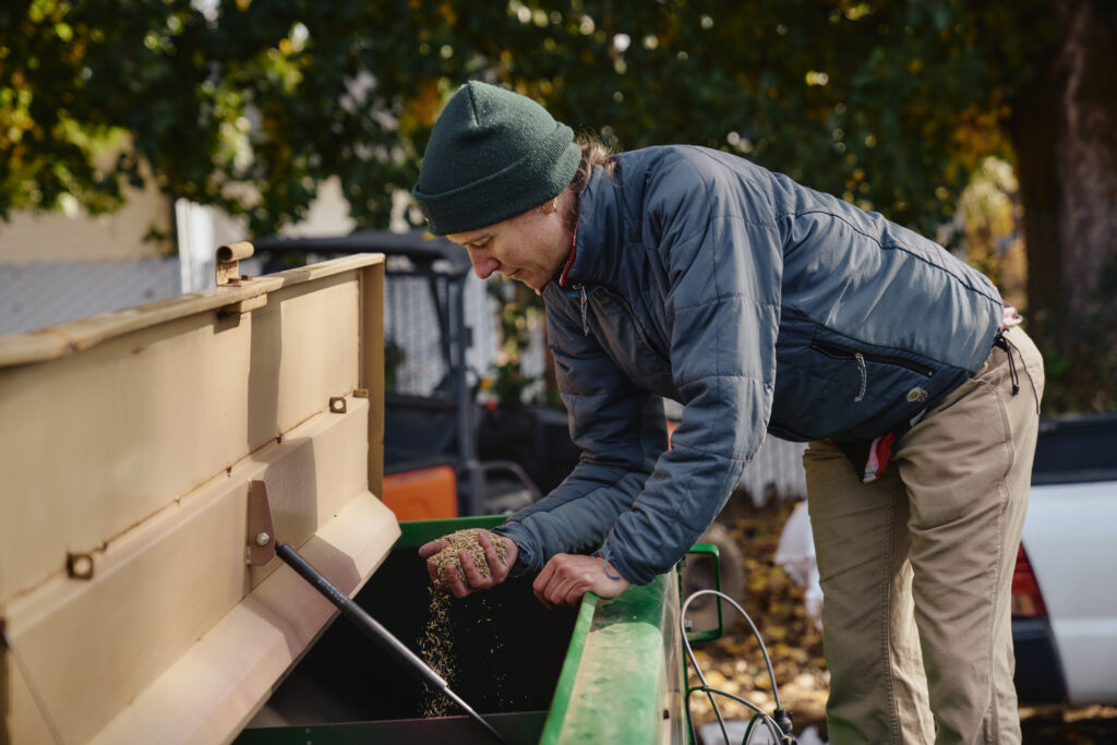 Land Trust staff with a handful of native seed