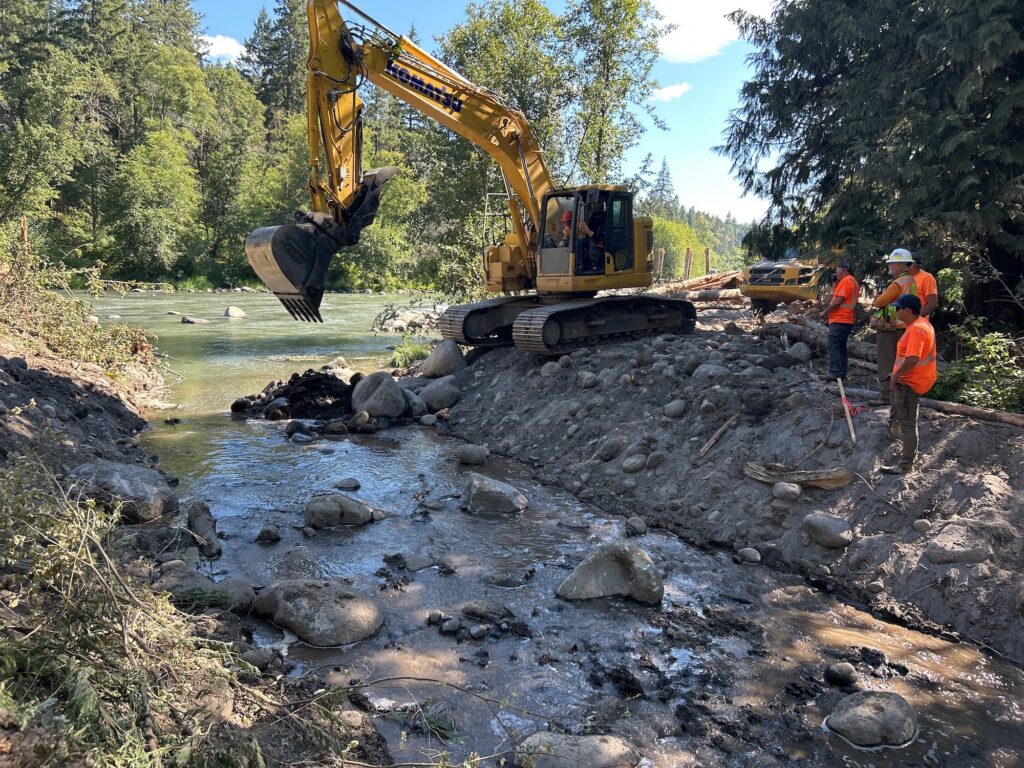 crews watch an excavator during the Hood River Mile 3 restoration project